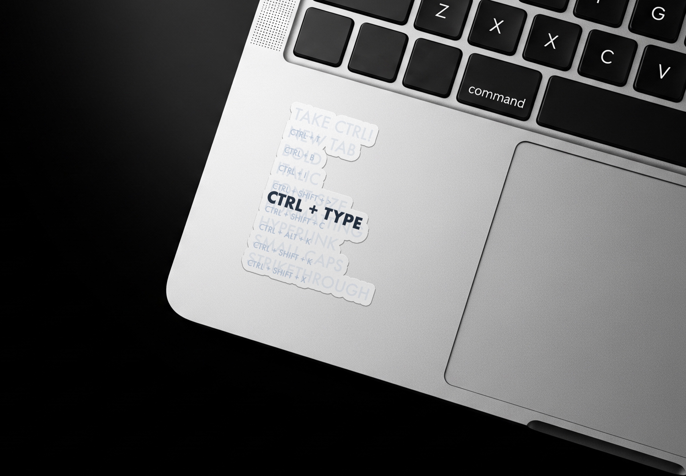 CTRL + TYPE command-pattern sticker applied to the palm rest of a laptop.